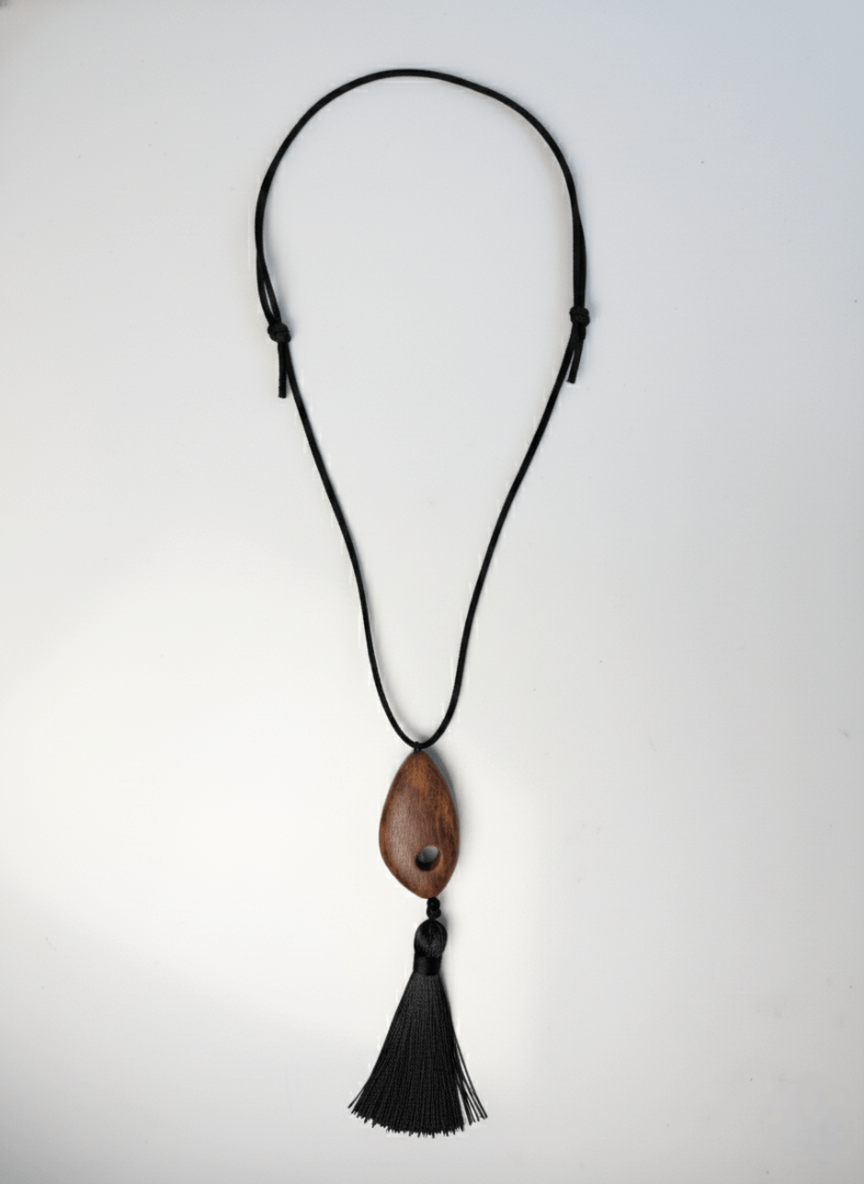 Necklace with a wooden pendant and black tassel - Vintaras Bette Tassel Necklace- on a white background