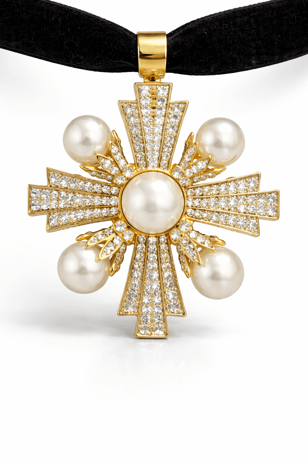 Cross-shaped pendant featuring pearls and small crystals on a black velvet ribbon