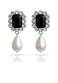 Pair of earrings with black gemstones and pearl drops on a white background