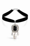 Black velvet necklace with a pendant featuring a black gemstone and pearl