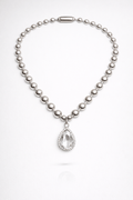 Silver necklace with a teardrop pendant on a white background