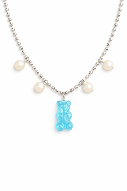 Dolce Bear Necklace with a blue gummy bear pendant and pearl-like beads on a white background