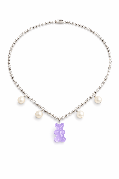 Dolce Bear Necklace with a purple gummy bear charm and pearl beads on a white background