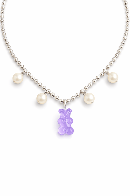 Dolce Bear Necklace with a purple gummy bear charm and pearl beads on a white background