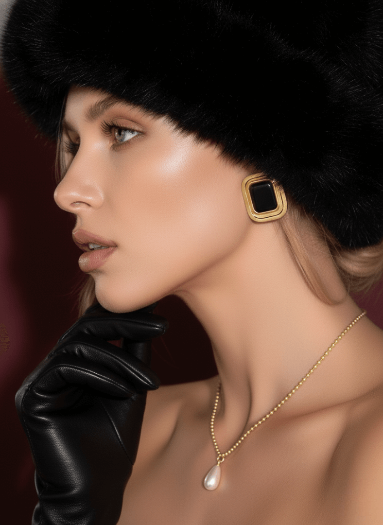 model wears black agate cabochon earrings, Vintaras Laila Earrings and Amore Necklace with pearl pendant.