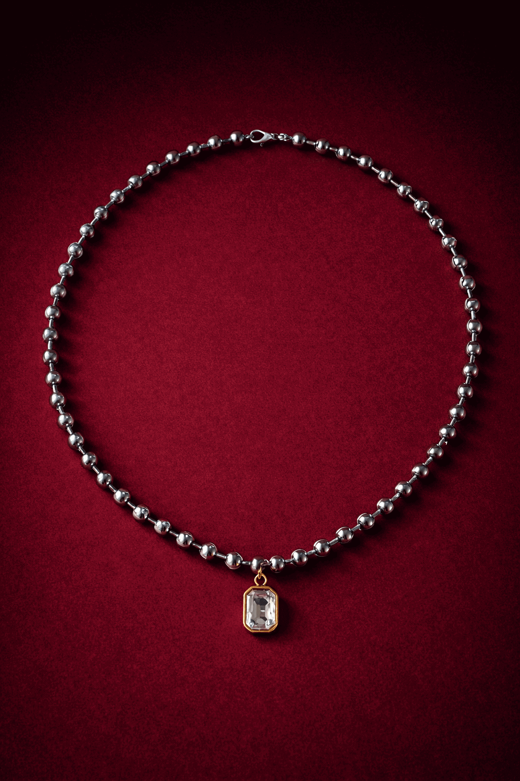 Ball chain necklace with a zirconia pendant on a red background, Madeleine Necklace by Vintaras.