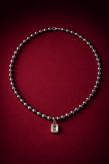 Ball chain necklace with a zirconia pendant on a red background, Madeleine Necklace by Vintaras.