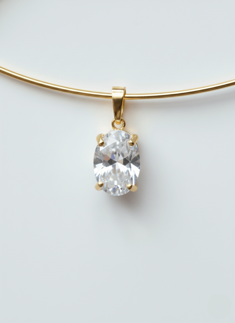 Vintaras Mila Gold cuff necklace with a zirconia pendant on a light gray background