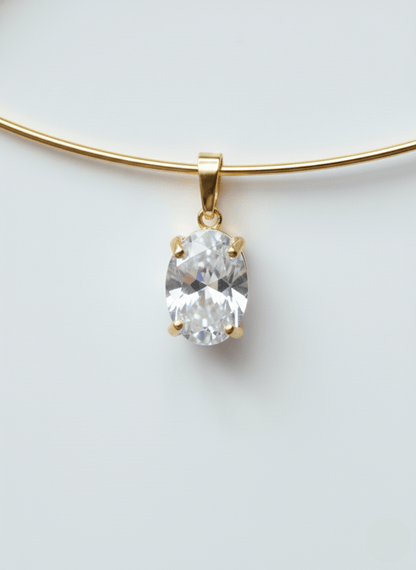 Vintaras Mila Gold cuff necklace with a zirconia pendant on a light gray background