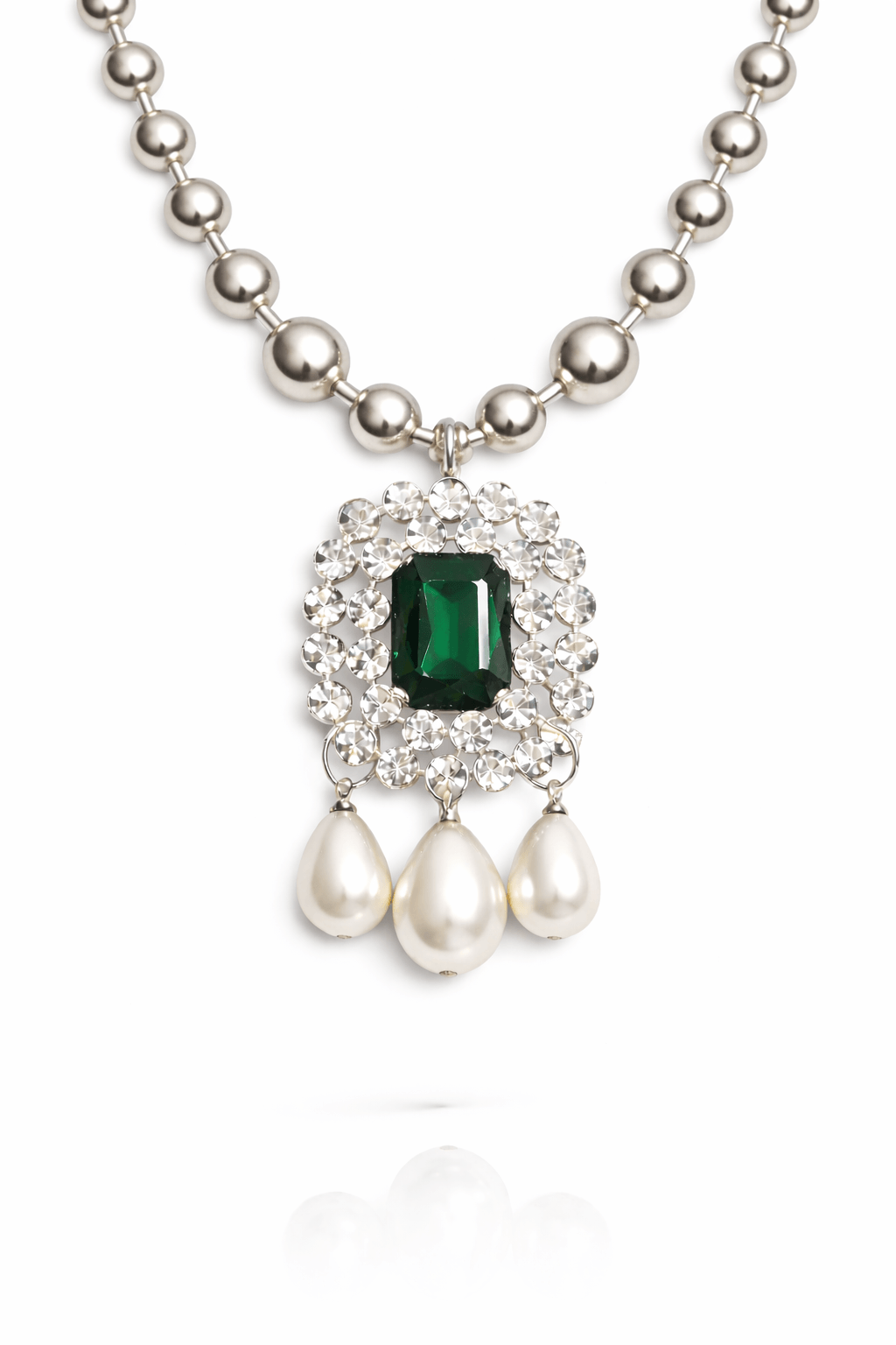 Necklace with green gemstone and pearl pendants on a white background