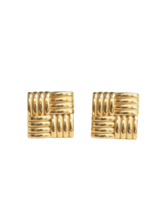 Pair of gold square stud earrings on a white background
