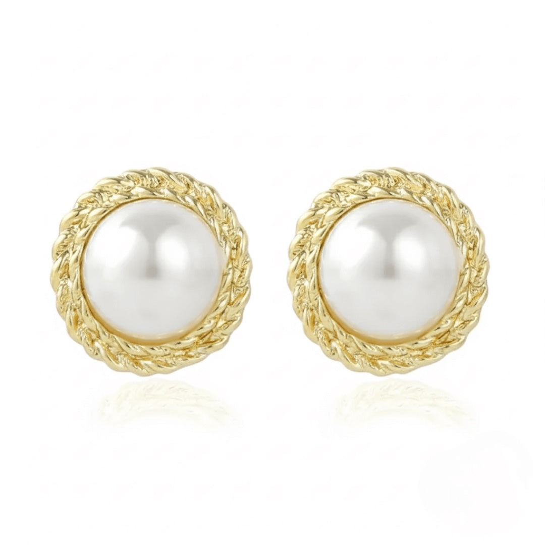 Pair of Vintaras Elise pearl earring with gold frames on a white background