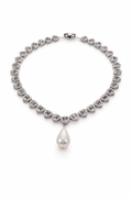 Silver necklace with heart-shaped crystals and a pearl pendant on a white background