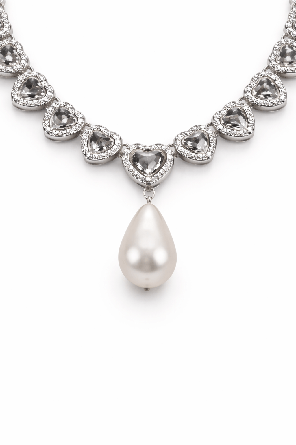 Elegant heart shaped zirconia necklace with a teardrop-shaped pearl pendant on a white background