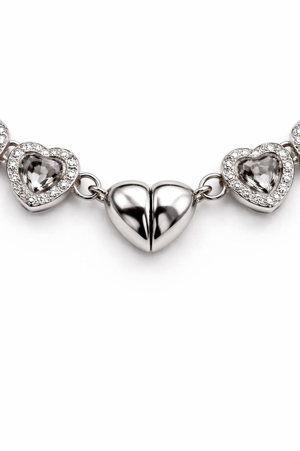 Silver heart-shaped zirconia necklace and a heart shaped closure on a white background