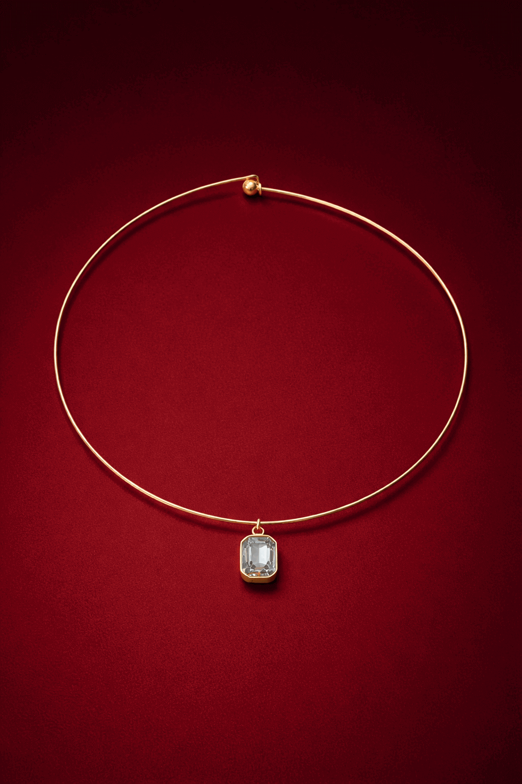 Gold cuff necklace with a zirconia pendant on a red background, Vera Cuff Necklace by VINTARAS.