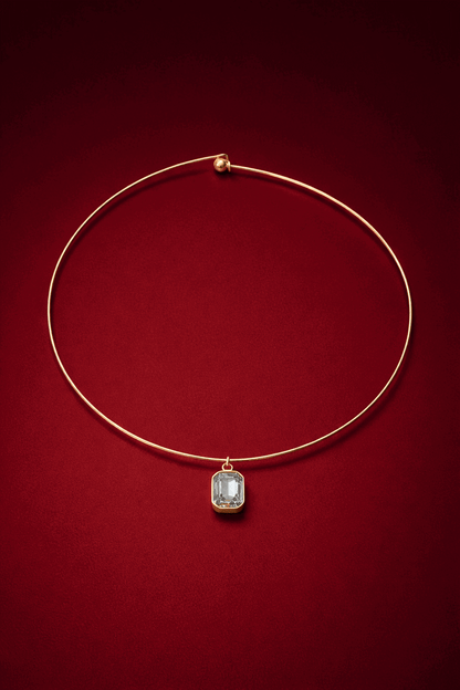 Gold cuff necklace with a zirconia pendant on a red background, Vera Cuff Necklace by VINTARAS.