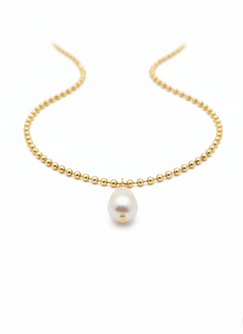 Gold beaded Vintaras Ingrid Necklace with a single tear drop pearl pendant on a white background