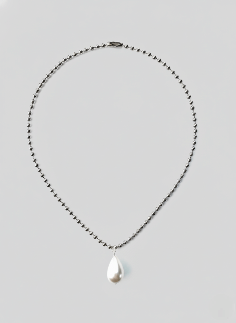 Vintaras Ingrid Necklace Silver with a teardrop-shaped pearl pendant on a light gray background