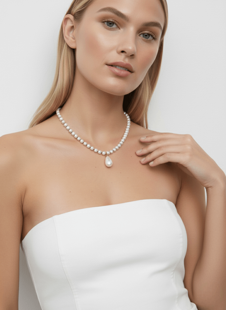 Woman wearing Vintaras Rita Pearl Necklace  against a plain background